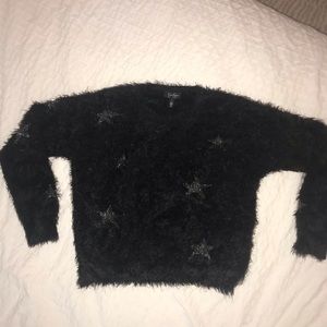 Black furry top with silver stars